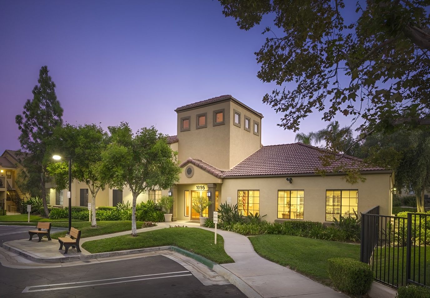 Exterior view of Vintage at Kendall Apartments at dusk