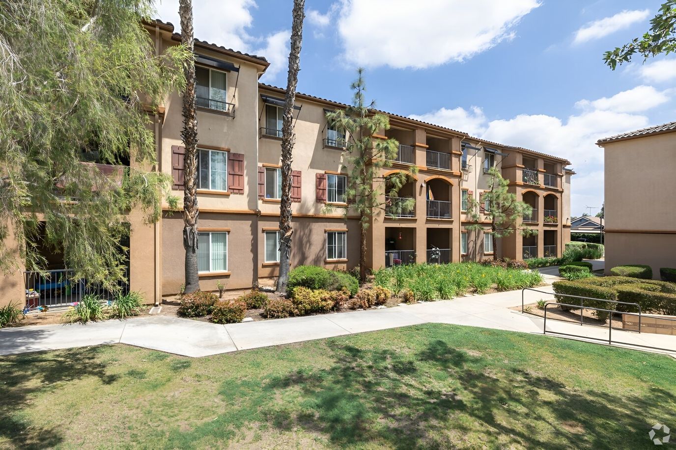 Exterior view of senior apartment complex with landscaping