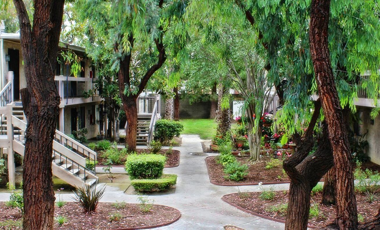 Lush courtyard with walkways and greenery