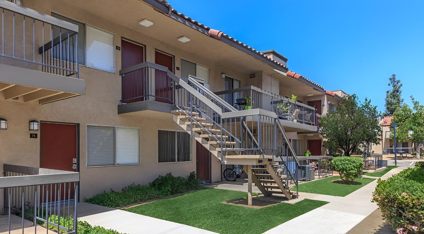 Exterior view of senior apartment building with greenery