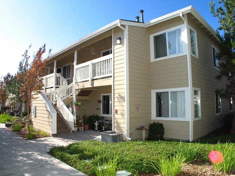 Exterior view of Vintage Park Senior Apartments with greenery