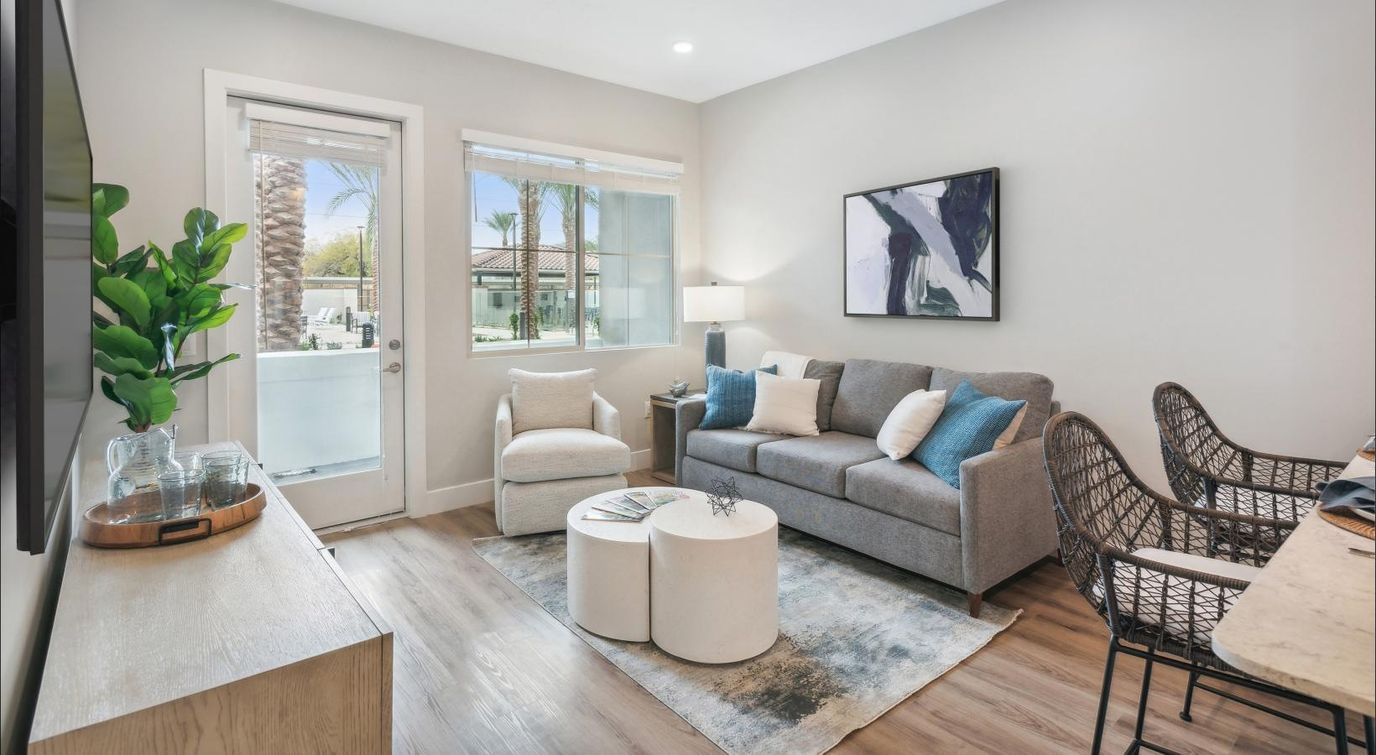 Bright, modern interior living space with a sofa and decor