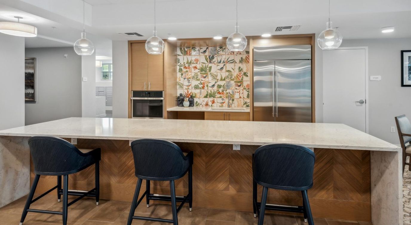 Modern common area with kitchen bar seating