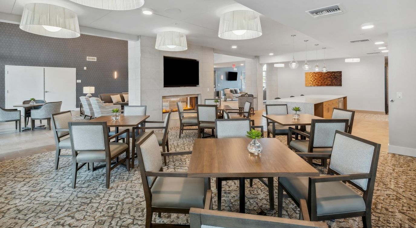 Bright common area with tables and seating
