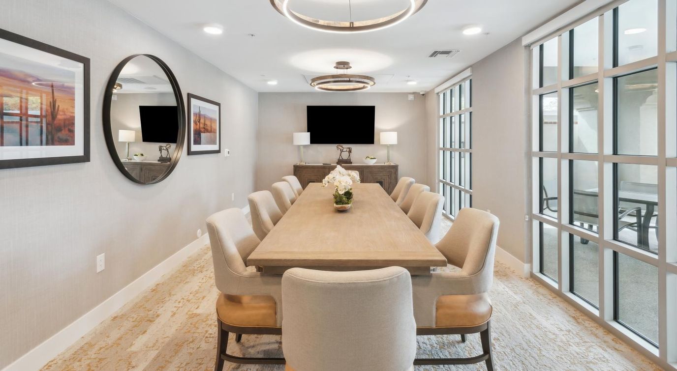 Interior view of a common area with a large table