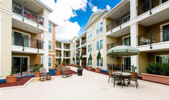 Outdoor courtyard with seating and plants