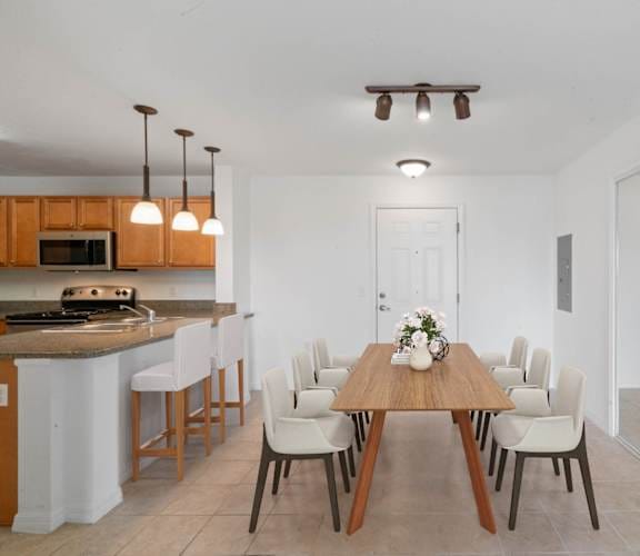 Modern dining area with a large table and chairs