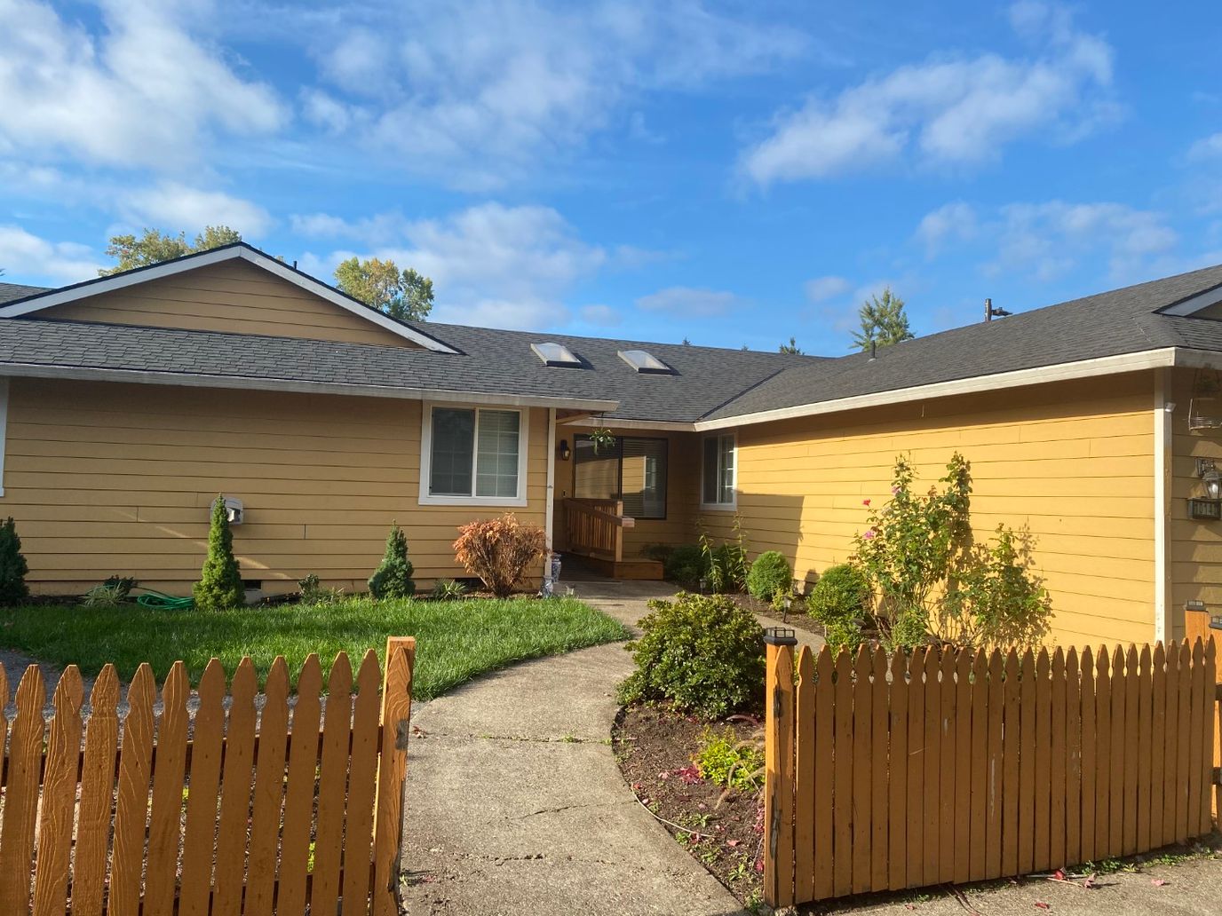 Exterior view of a senior care facility with garden