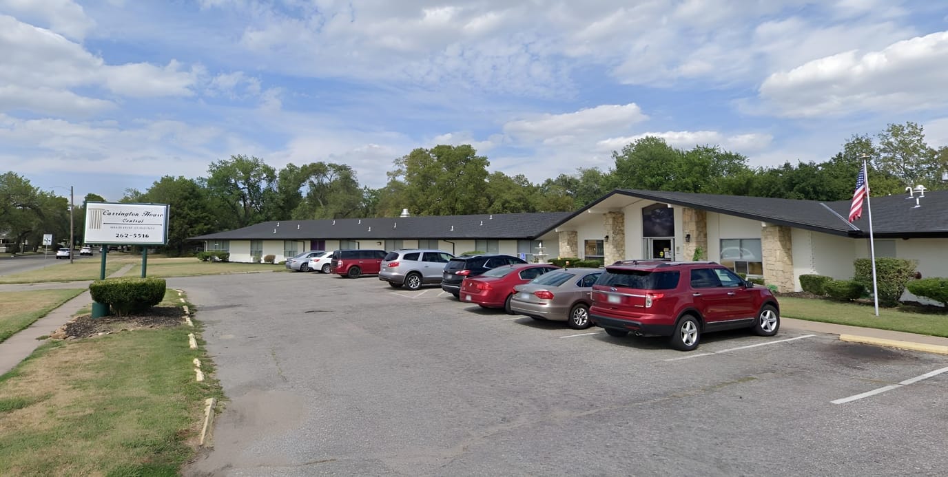 Exterior view of the facility with parking area