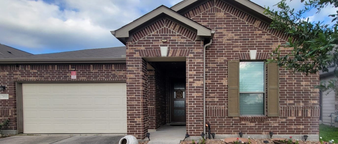 Exterior view of a residential building with brick facade