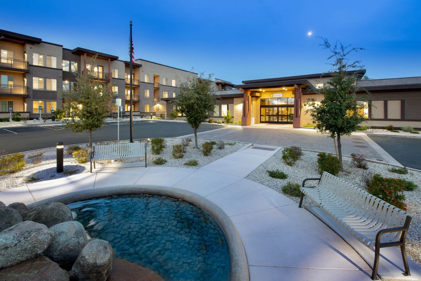Exterior view of the facility with landscaping and seating areas