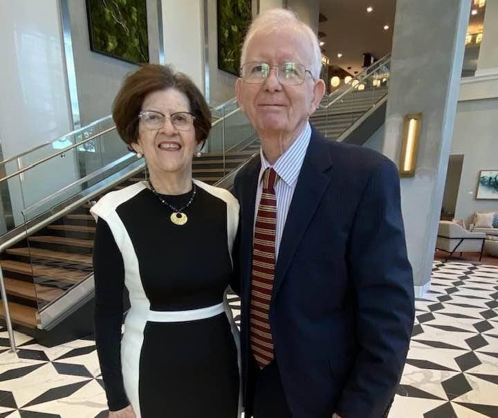 Couple posing in an elegant lobby area
