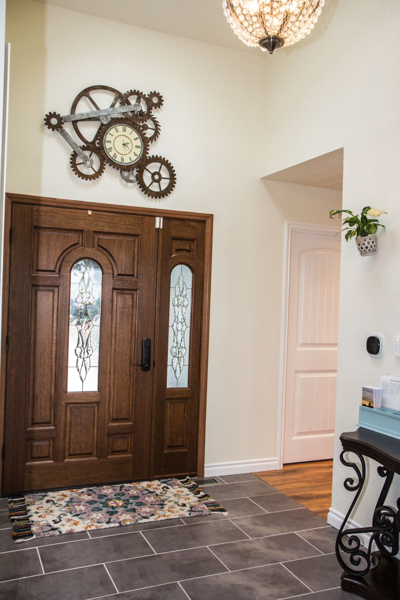 Entrance hallway with decorative clock and front door