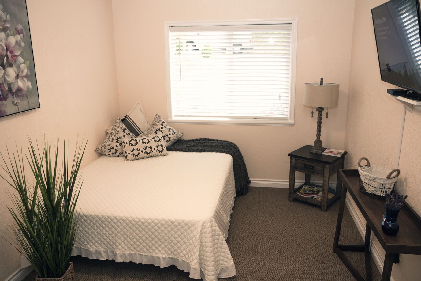 Cozy private resident room with bed and decor