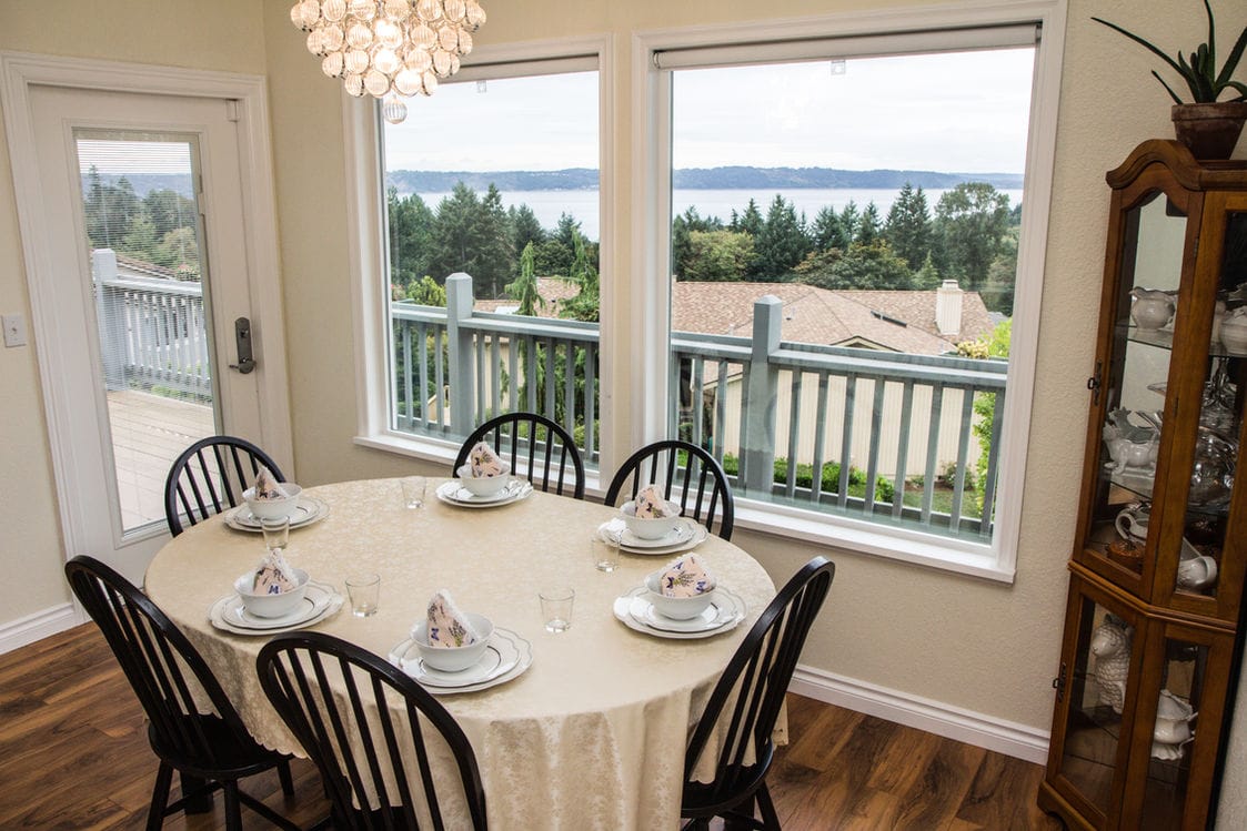 Dining area with a scenic view overlooking the water