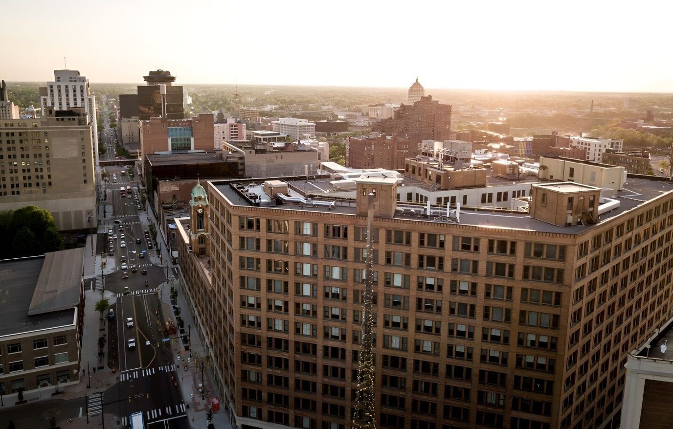 Aerial view of a cityscape with a large building