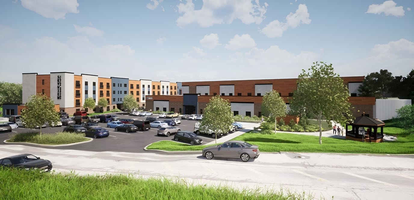Exterior view of Skyview Park Apartments with parking and landscaping