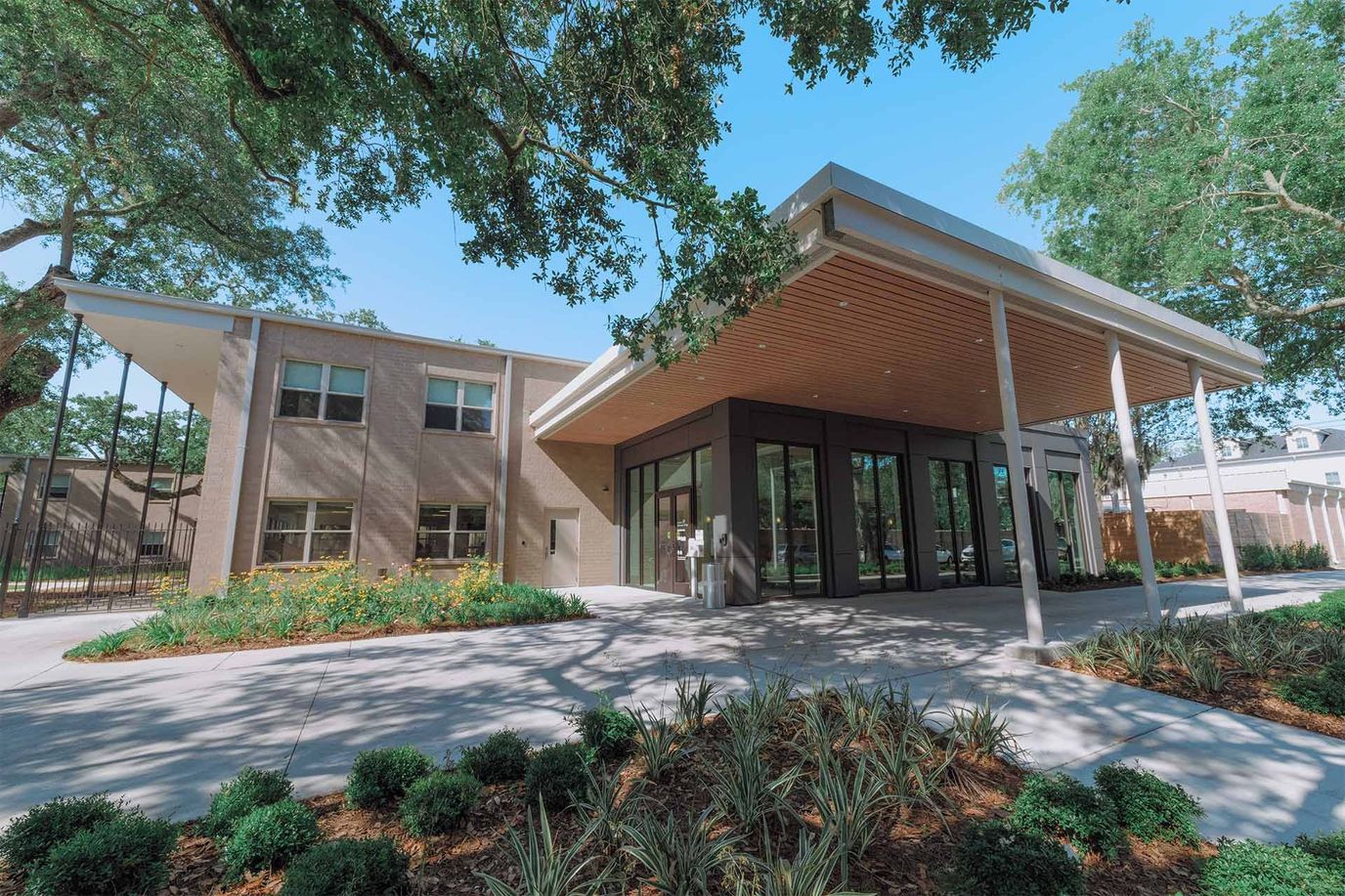 Modern facility entrance with landscaped surroundings