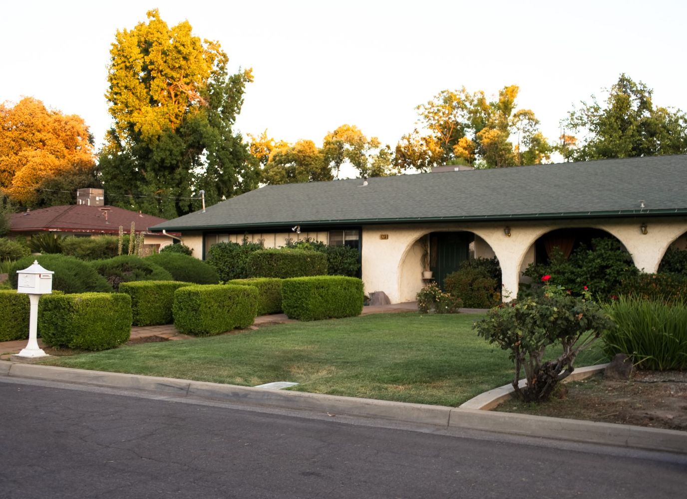 Exterior view of a senior care facility surrounded by greenery