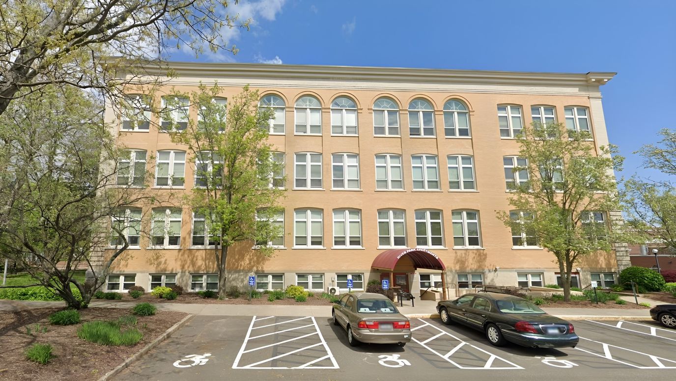 Exterior view of River Park Apartments building
