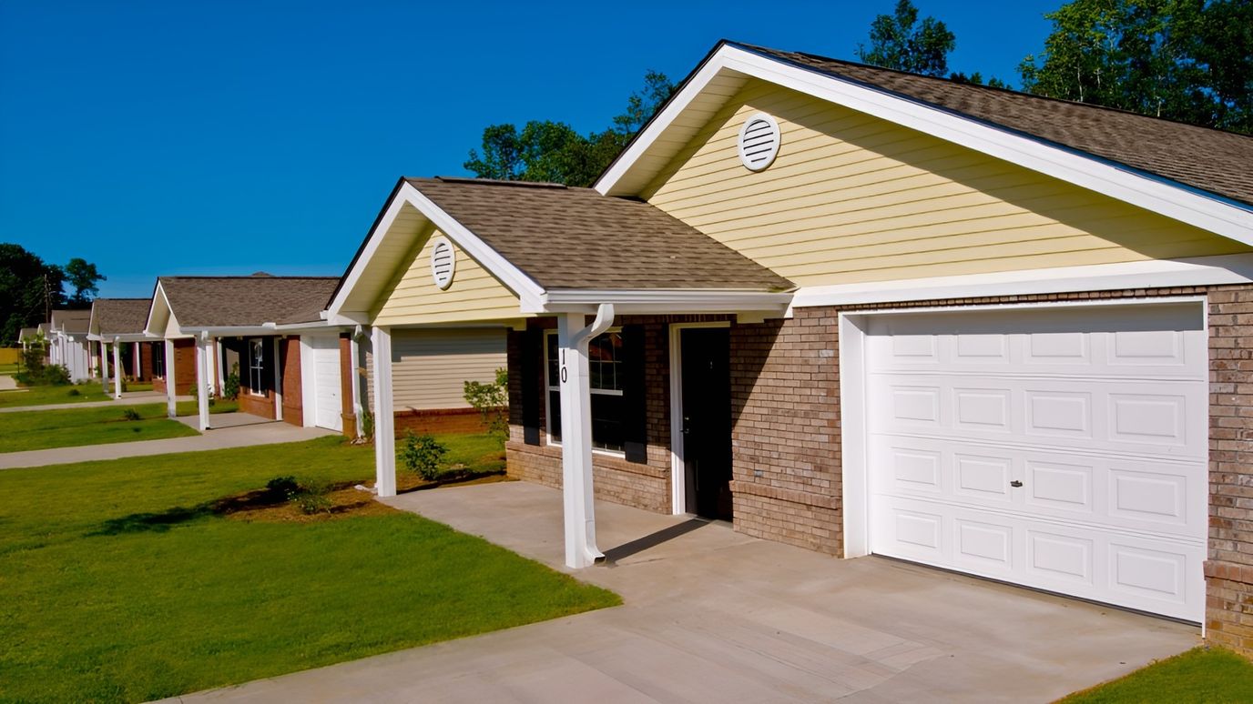 Exterior view of assisted living cottages with well-maintained lawns