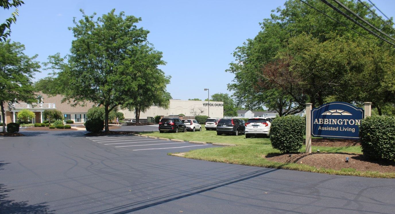 View of Abbington Assisted Living building and parking area
