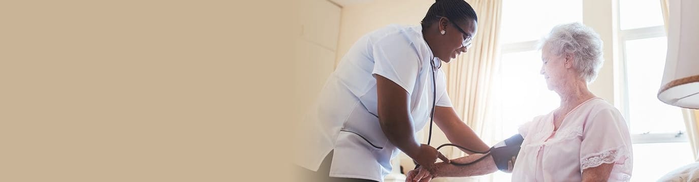 Nurse taking a resident's blood pressure