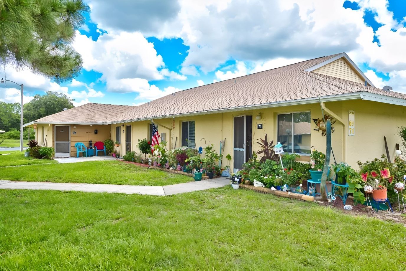 Exterior view of a senior living facility with gardens