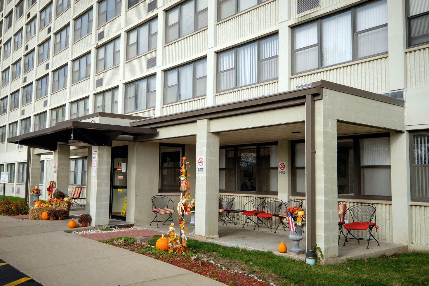 Exterior view of the facility entrance with seating area