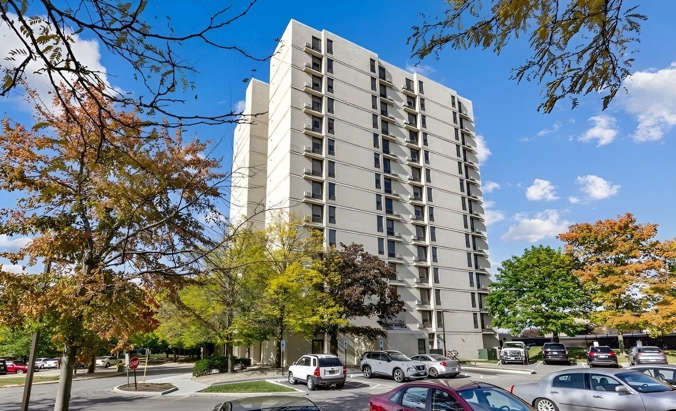 Exterior view of Park Tower Apartments surrounded by trees