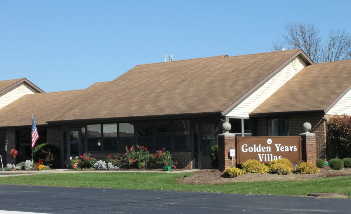 Exterior view of Golden Years facility with landscaped gardens