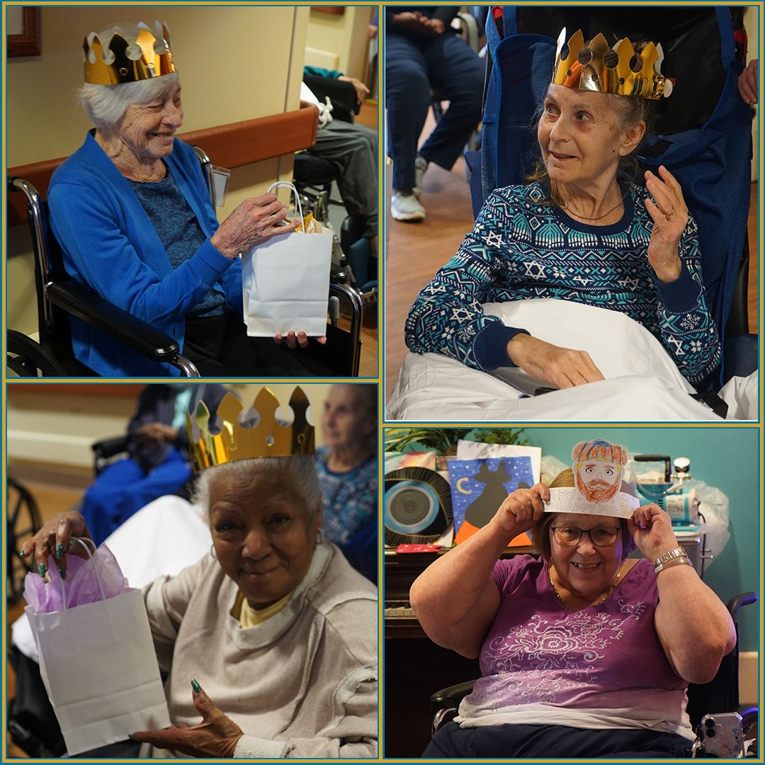Residents celebrating with crowns and gift bags