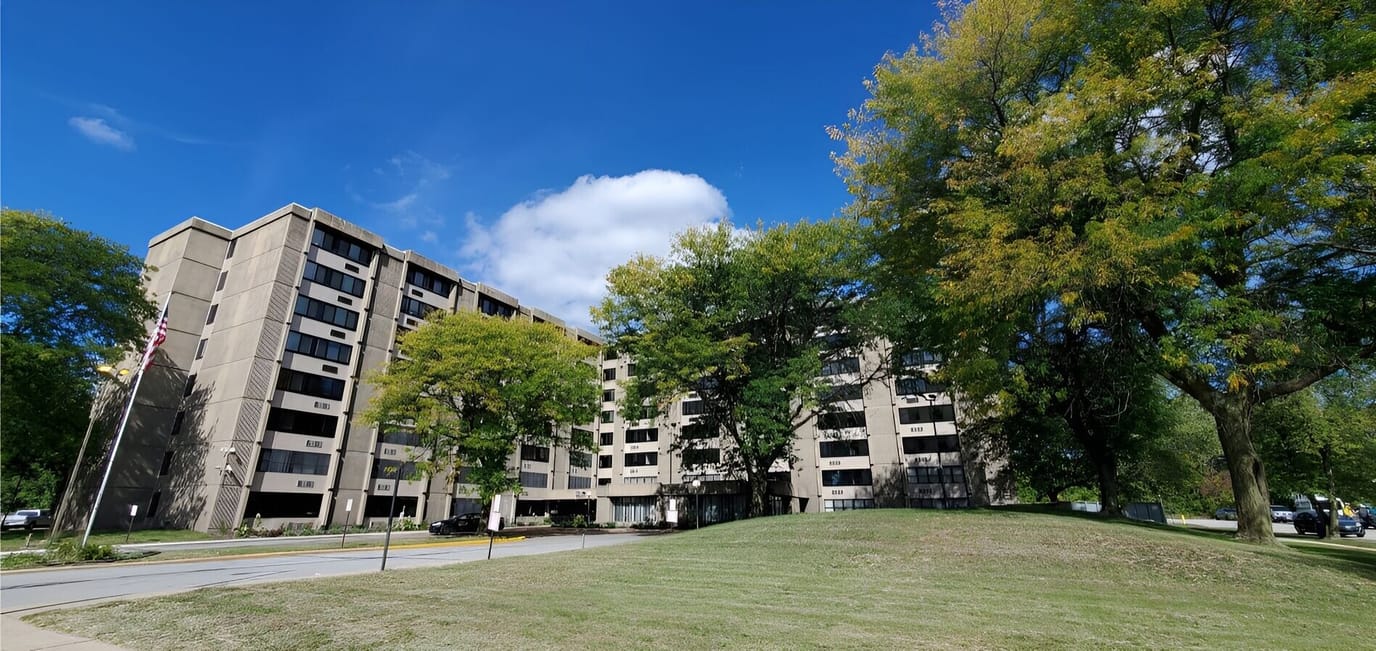 View of the senior living facility with greenery