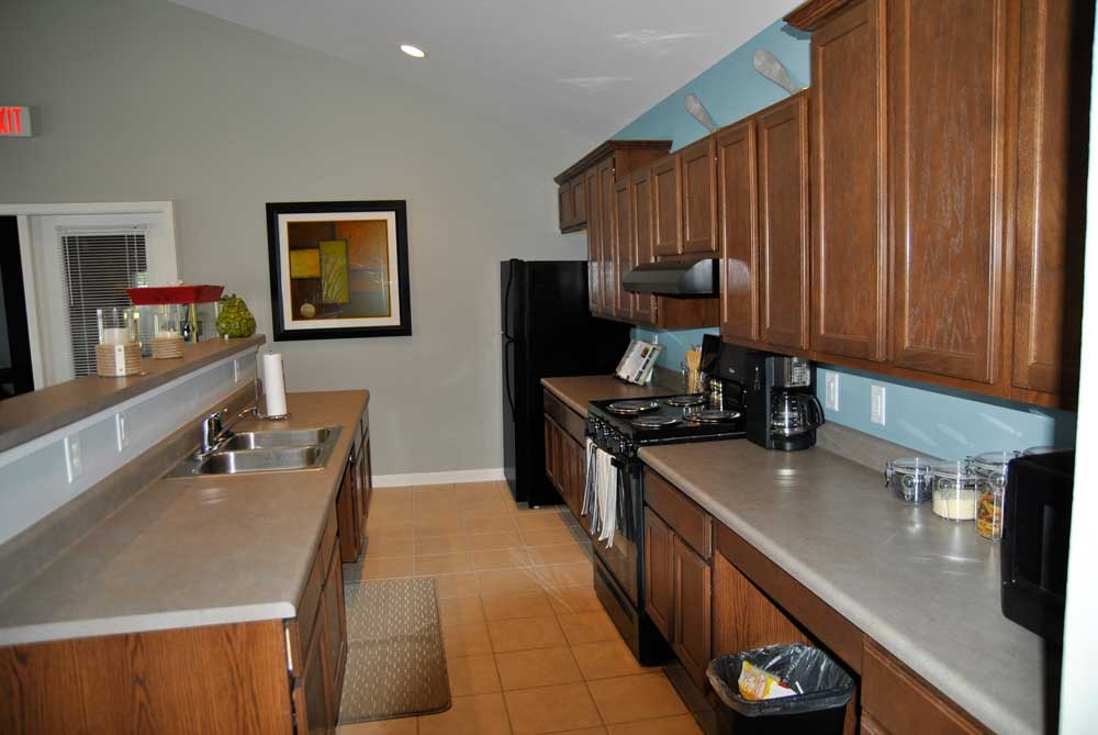 Interior kitchen of a facility with wooden cabinets