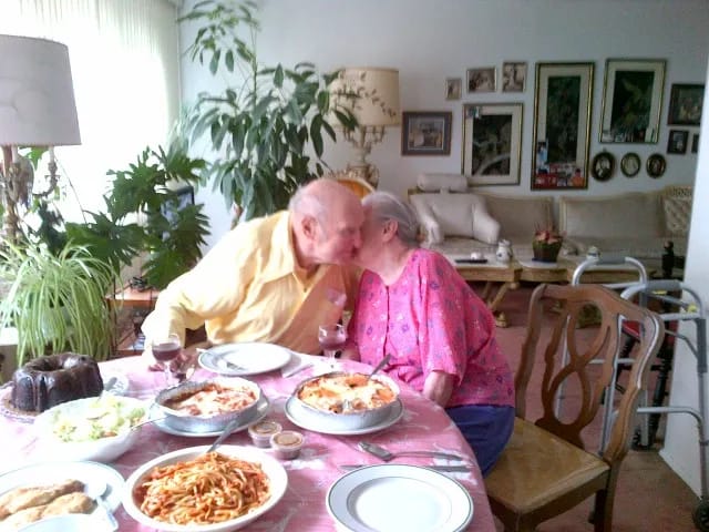 Couple enjoying a meal together in a cozy dining area