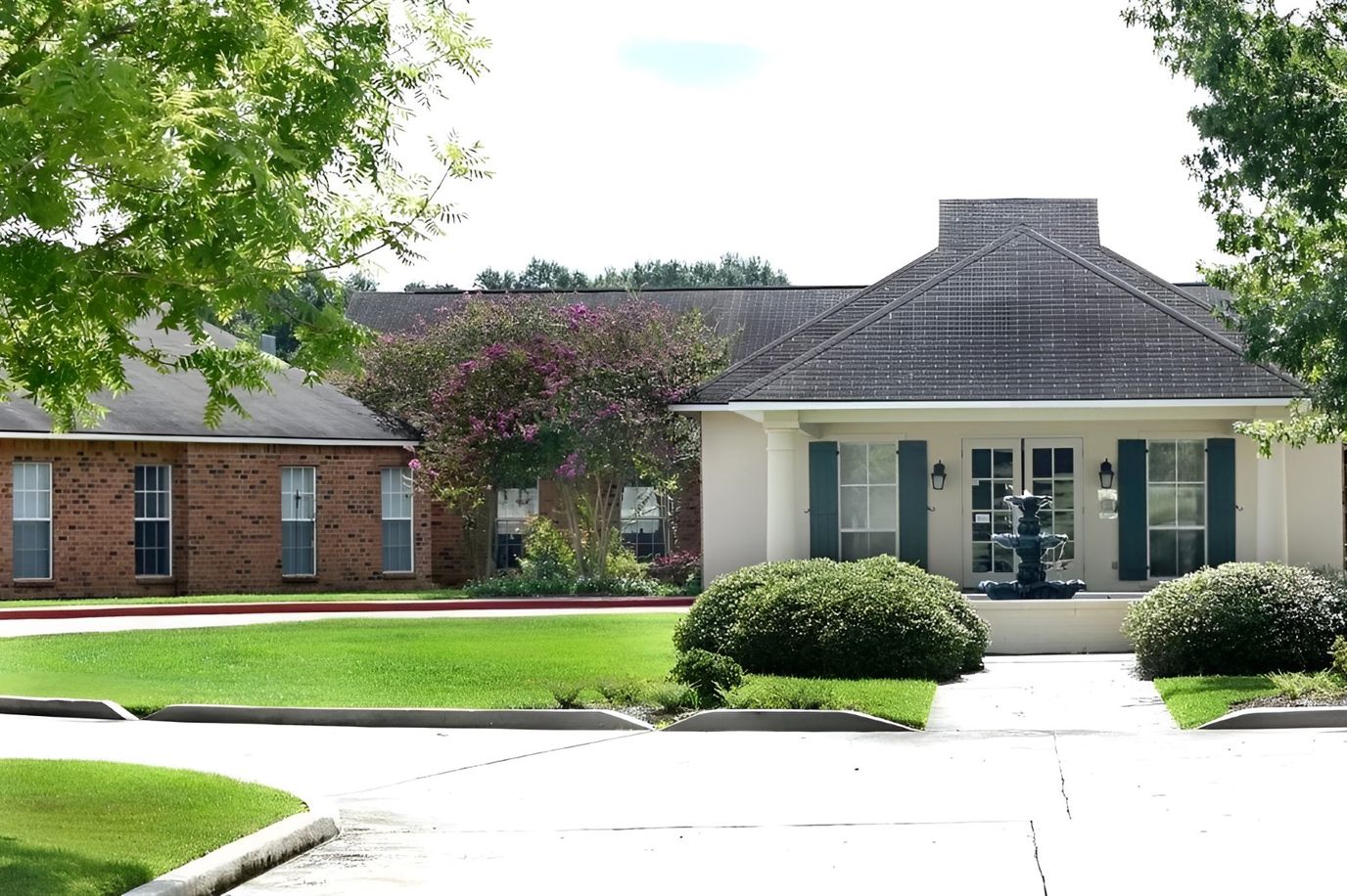 Exterior view of Oakwood Village with landscaping
