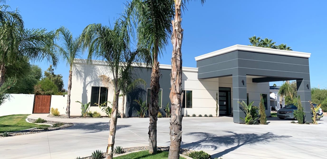 Exterior view of Agave Manor with palm trees