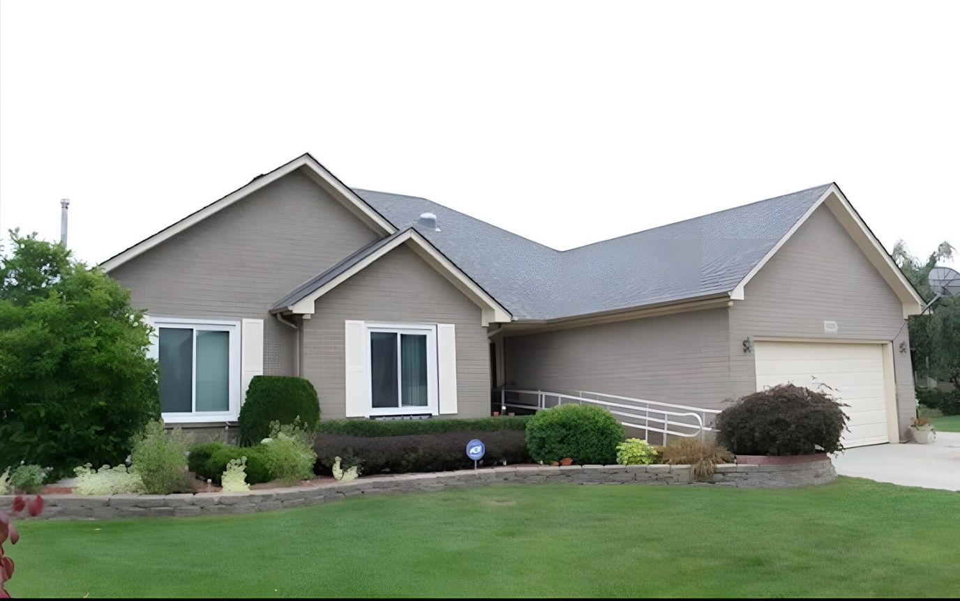 Exterior view of Serenity Homes LLC with landscaped yard