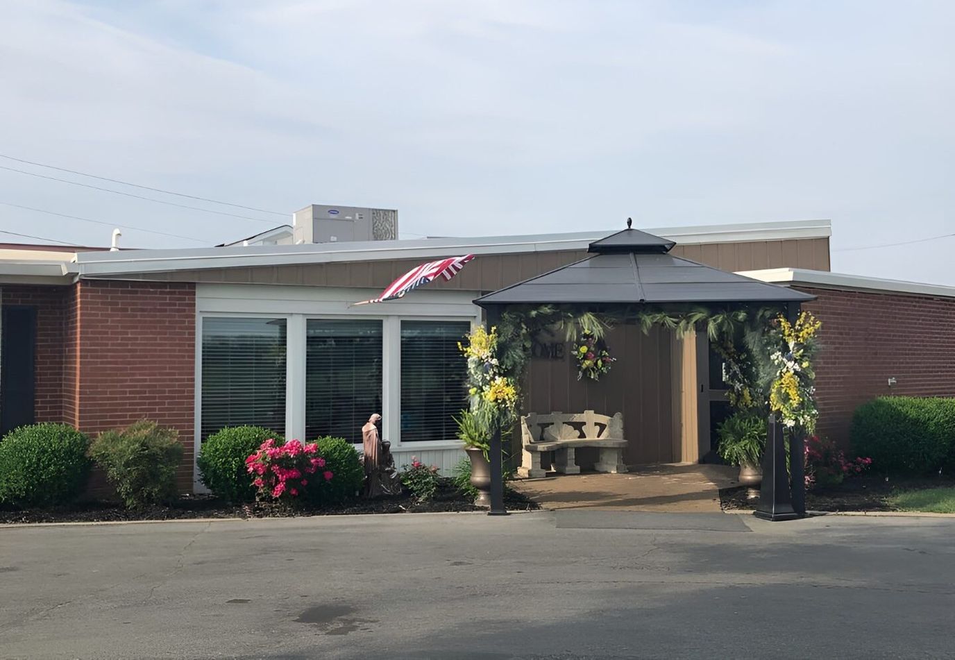 Exterior view of a facility entrance with decorations