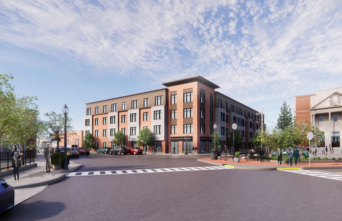 Exterior view of Logan Square Residences with nearby trees and people