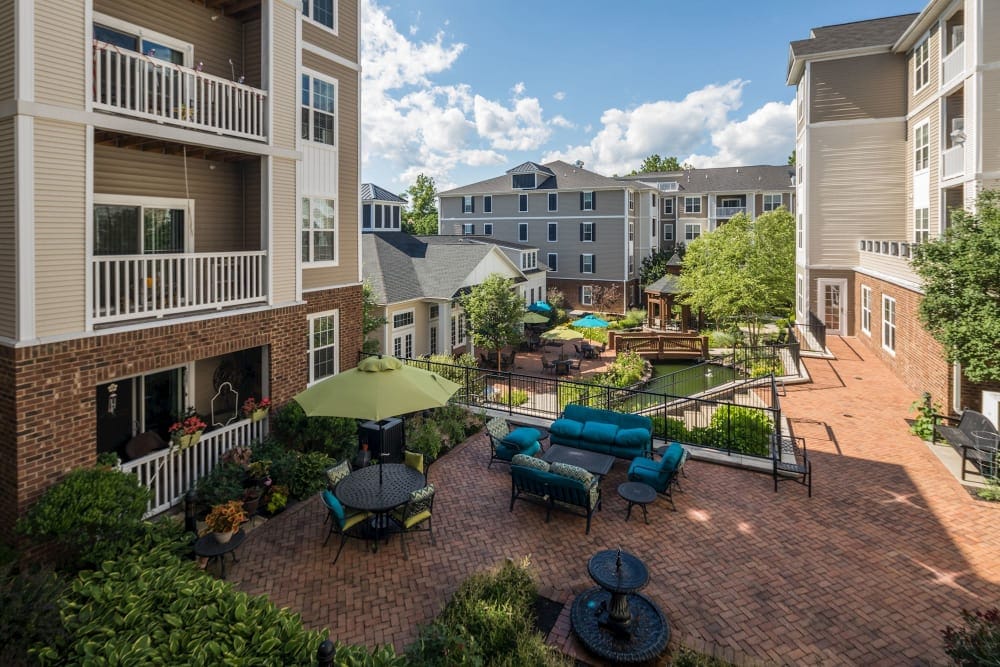 Outdoor courtyard with seating and greenery