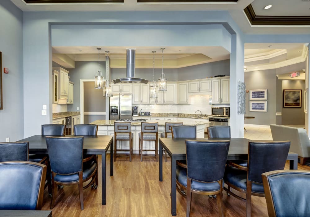 Bright dining area with chairs and modern kitchen