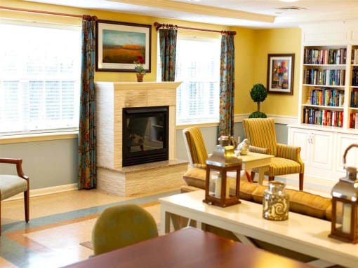 Cozy interior common area with a fireplace and seating.