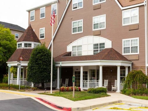 Exterior view of the facility with gardens and porch.