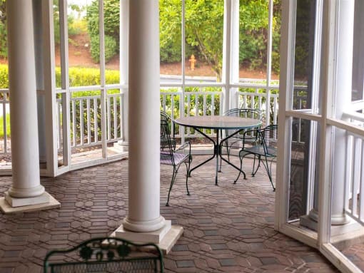 Outdoor seating area with tables and chairs