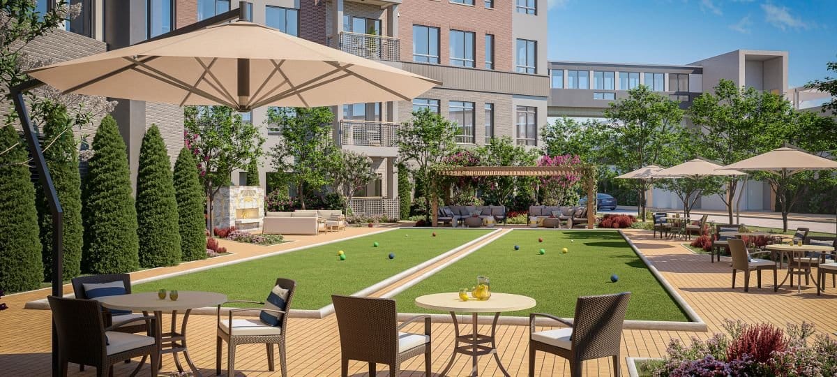Outdoor area with seating and lawn for activities.
