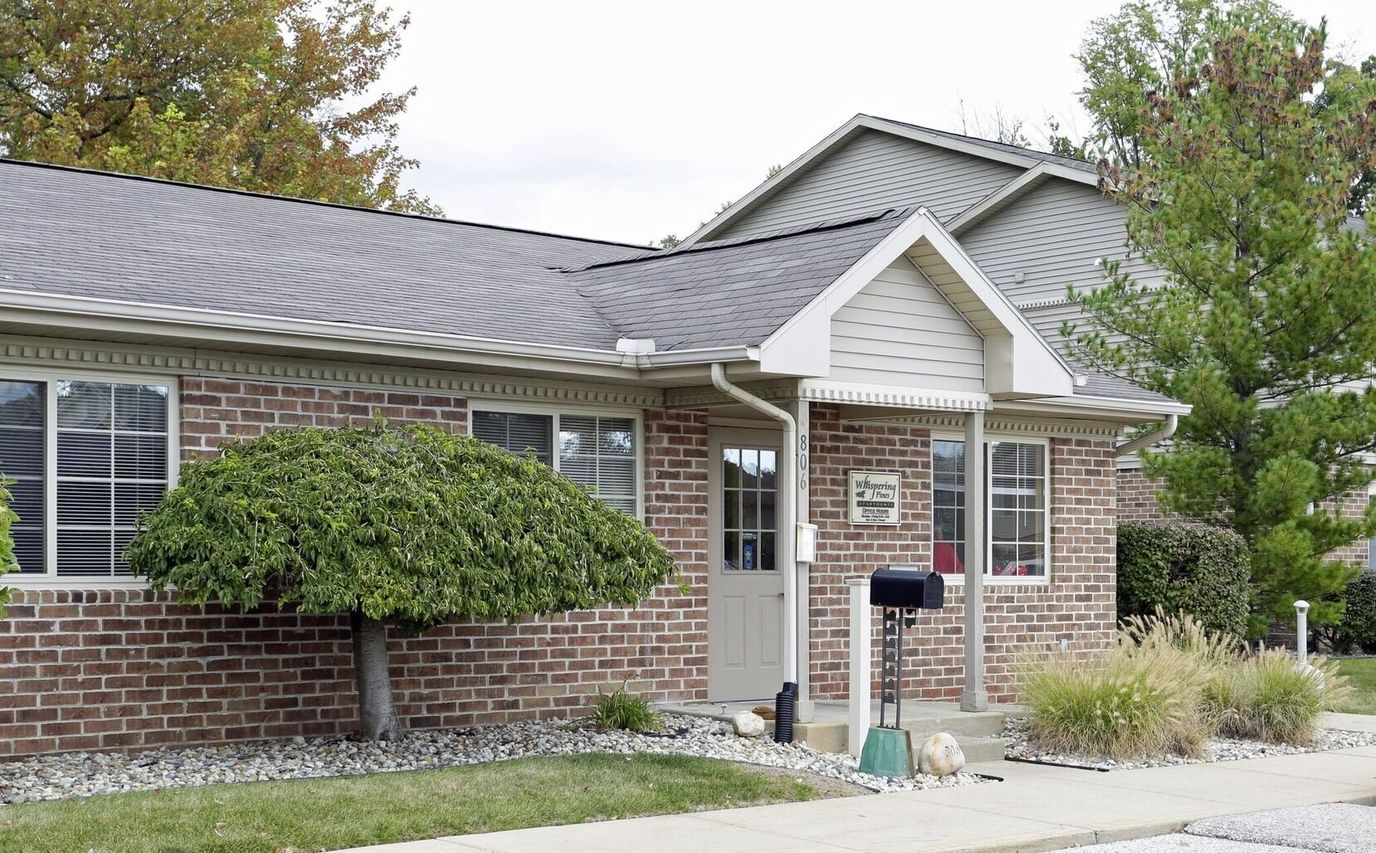 Exterior view of Whispering Pines Apartments