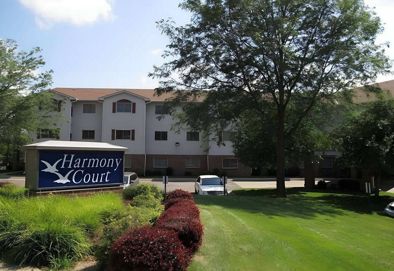 Harmony Court building with signage in front