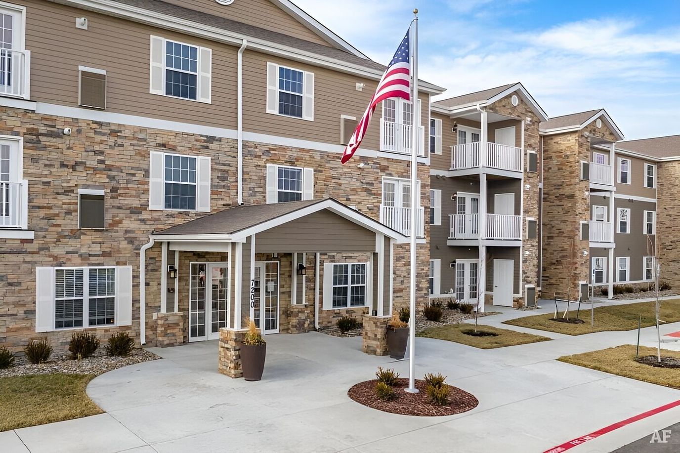 Exterior view of Connect55+ Shawnee with flag