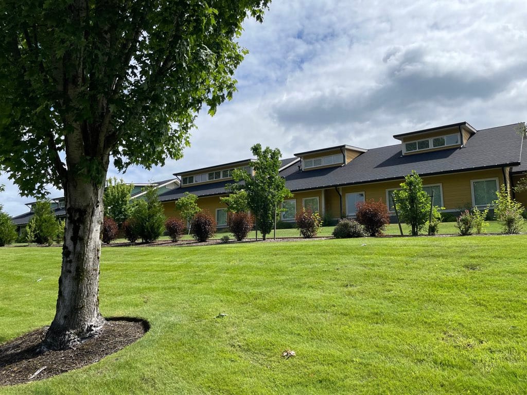 Exterior view of the Cottages of Lacey building and landscaping